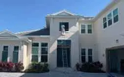 Freshly painted two-story home exterior with clean, updated finish