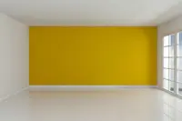 Yellow accent wall interior painting to brighten a modern living space